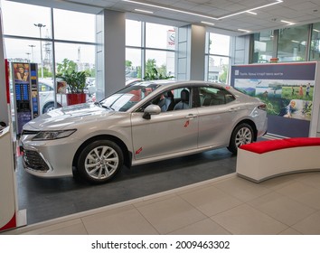 KYIV, UKRAINE - MAY 15, 2021: New White Toyota Camry Car On Display In Car Dealership City Plaza. It Is An Automobile Sold By Japanese Manufacturer Toyota Since 1982, Spanning Multiple Generations.