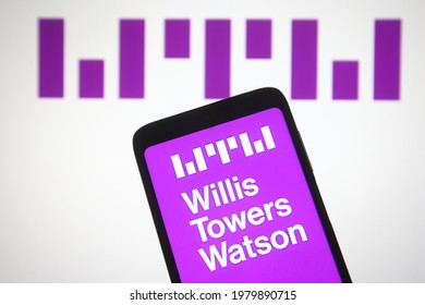 KYIV, UKRAINE - MAY 25, 2021: In This Photo Illustration Willis Towers Watson Public Limited Company Logo Is Seen On A Mobile Phone And A Computer Screen.