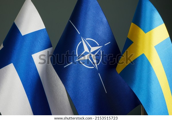 KYIV, UKRAINE - May 7, 2022. Flags of Sweden,\
Finland and NATO.
