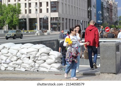 Kyiv, Ukraine - May 8 2022: People At The Entrance To An Underground Passage On The Central Square; Entrance To Underground Passage Half Blocked With Sandbags