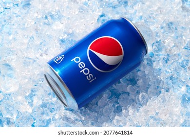 Kyiv, Ukraine - November 13, 2021. Pepsi Can In Crushed Ice. Soft Drink Summer Refreshment Concept