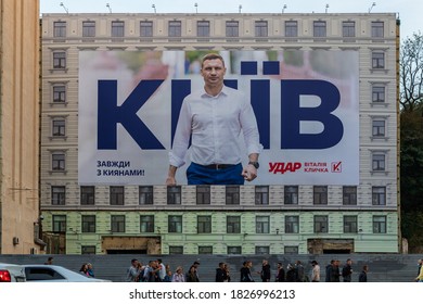 Kyiv, Ukraine - October 04, 2020: A poster depicting Kyiv Mayor Vitali Klitschko in central Kiev on the eve of the elections. An advertising poster covers a destroyed building on the central street.