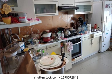 Kyiv, Ukraine - October 14, 2019: Interior Of Modern Stylish Kitchen With Huge Mess Of Utensils On Work Place After Party Dinner.