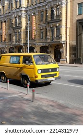 Kyiv, Ukraine - October 14 2022: Retro Yellow Volkswagen Minivan Driving In City Traffic