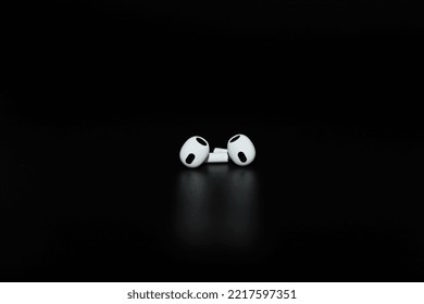 Kyiv, Ukraine - October 14, 2022: Apple AirPods (3rd Generation). True Wireless Earphones, Earbuds From Apple. White Apple AirPods 3 With Spatial Audio On Black Background