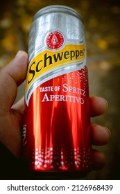 KYIV, UKRAINE - OCTOBER 24, 2021: A Can Of Schweppes Spritz Aperitivo In A Man's Hand