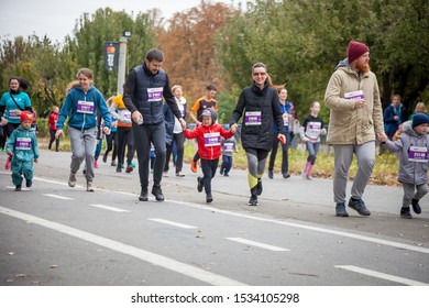 Kyiv, Ukraine - October 5, 2019: A Family Race As Part Of The Marathon. Running People, Parents And Children Participate In A Street Sporting Event.