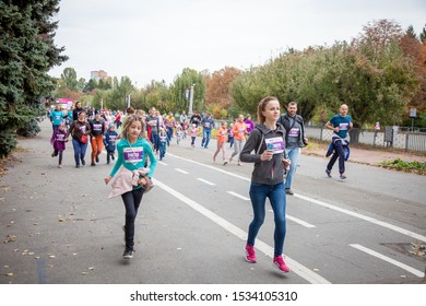 Kyiv, Ukraine - October 5, 2019: A Family Race As Part Of The Marathon. Running People, Parents And Children Participate In A Street Sporting Event.