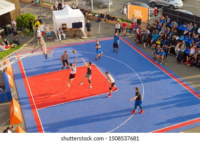 KYIV, UKRAINE - SEPT 14, 2109: Men play basketball on a street. Street ball championship. Aerial view