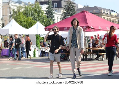 Kyiv, Ukraine - September 11 2021: Very Tall Young Man Walking The Street With A Friend