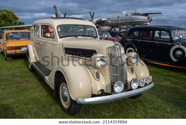 KYIV UKRAINE - SEPTEMBER 18 2021: Dodge Model\
DU 1935 luxury car, the first model of the brand that received a\
streamlined shape. The emblem of a ram on a lattice of a radiator\
also attracts attention