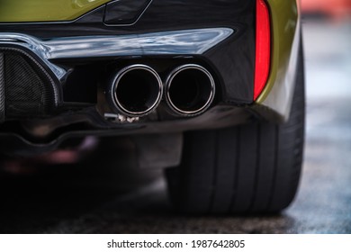 KYIV-15 MAY,2021: Dual exhaust pipes on BMW M5 F90 G30 vehicle made by Akrapovic for performance tuning and carbon fiber parts on body kit