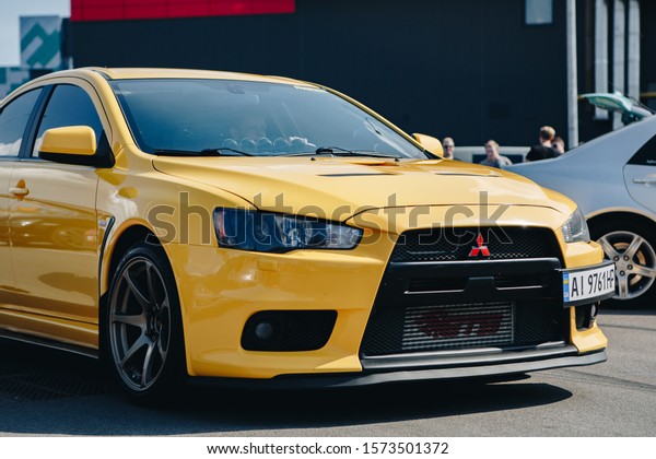 KYIV-28 JULY,2019: JDM car show outdoor.Tuned\
Japanese drift cars expo in summer.Modified Mitsubishi Lancer\
Evolution X vehicle with lowered\
suspension