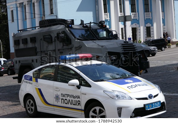Kyiv/Ukraine - 08.03.2020: Ukrainian\'s security\
service armored vehicle and police car on the street during the\
assault to the Leonardo business center where was terrorist and\
hostages.