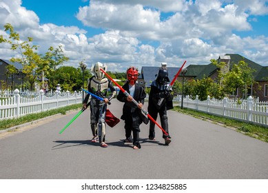 Kyiv/Ukraine - August 15, 2018: Cosplayers Kids Dressed As Characters From Star Wars Movie  With Swords And Plays On Streets. Halloween Costumes, Cosplay Concept