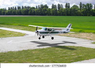 Kyiv/Ukraine - July 15,2020: Cessna 172 is landing. Small airplane in the sky, student is learning how to land on the ground.