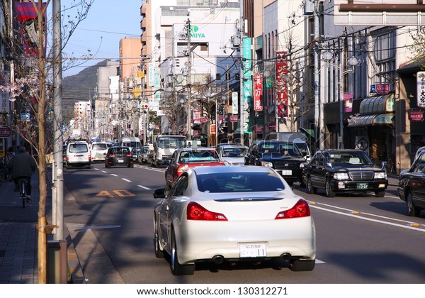 KYOTO, JAPAN - APRIL 14: Cars drive in heavy\
traffic on April 14, 2012 in Kyoto, Japan. With 589 vehicles per\
capita, Japan is among most motorized countries worldwide, which\
causes heavy traffic.