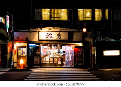 Kyoto, Japan - April 9, 2019: Gion Evening Night With Facade Of Restaurant Izakaya Exterior For Shrimp And Seafood Skewers