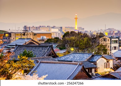Kyoto, Japan city skyline over temple rooftops.