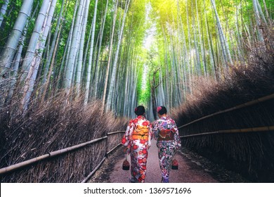 Kyoto, Japan Culture Travel - Asian Traveler Wearing Traditional Japanese Kimono Walking In Arashiyama Bamboo Forest Grove In The Old Town Of Kyoto, Japan.