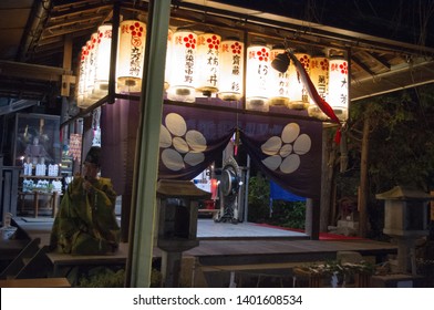 Kyoto, Japan - December 31, 2013: New Year gathering and ceremony at a small local shrine in the north of Kyoto
