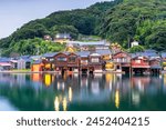 Kyoto, Japan at Ine Bay historic funaya boathouses at dusk.