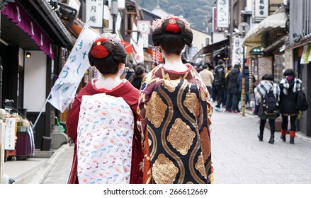 Kyoto, Japan - March 2015 - Geisha Wears Traditional Clothes With Signature White Powder On Neck