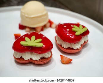 Kyoto, Japan - March 31, 2019: Seasonal strawberry macaroon and ice cream dessert at Godiva boutique in Daimaru department store