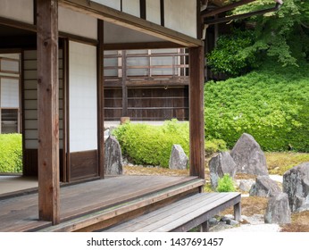 Kyoto, Japan - May 10, 2019: Part of engawa veranda and Japanese stone garden of a quiet Komyoin temple designed by famous landscape historian and designer Shigemori Mirei