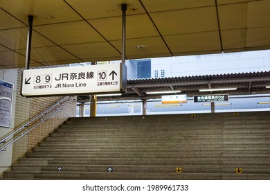 Kyoto, Japan - May 2014: Stairway To Platform In The Kyoto Station With White Information Board Hanging From Ceiling. No People.