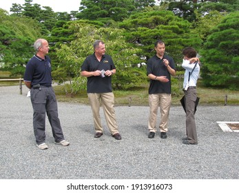 KYOTO, JAPAN - SEPTEMBER 16, 2010: NASA Astronauts Jeffrey N. Williams And Timothy J. Creamer, JAXA Astronaut Soichi Noguchi And The Japanese Guide At An Organized Tour At Kyoto Imperial Palace.