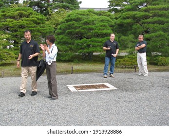 KYOTO, JAPAN - SEPTEMBER 16, 2010: Russian Cosmonauts Maksim Surayev And Oleg Kotov, JAXA Astronaut Soichi Noguchi And The Japanese Guide At An Organized Tour At Kyoto Imperial Palace.