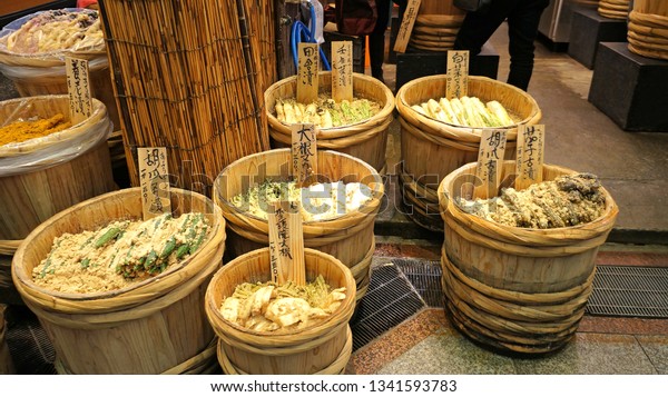 KYOTO, KYOTO PREFECTURE, JAPAN - DECEMBER\
31, 2017; Food displays from a shop in Nishiki Market in Kyoto.\
That store is selling a variety of pickled vegetables known in\
Japan as \