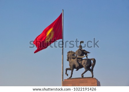 Kyrgyzstan - Bishkek - Monument for Manas, hero of ancient kyrgyz epos, together with national Kyrgyzstan flag on Bishkek central Ala-Too square