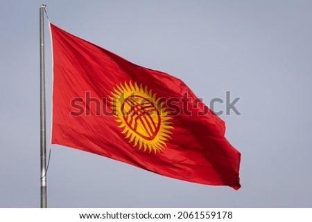 Kyrgyzstan flag waving on a flagpole