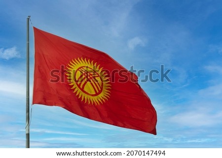 Kyrgyzstan flag waving on a flagpole