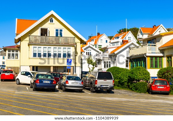 Kyrkesund, Tjorn, Sweden - May 18, 2018: Travel\
documentary of everyday life and place. It is very hard to find\
vacant parking space in the small village. Parking is either\
private or not\
allowed.