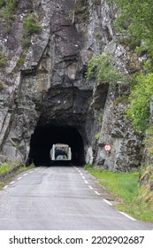 Kyrping, Norway - June 9, 2022: The Old Akra Fjord Road, POV From A Tesla Model 3 Driving On The Scenic Route. Tunnel And Bridges In A Cloudy Spring Day. Selective Focus