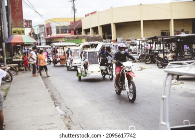 LA CARLOTA CITY, PHILIPPINES - Feb 01, 2019: A Busy City Street With Tricycles And Motorbikes In The Philippines