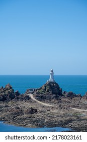 La Corbiere Lighthouse On The Headland Of St Brelade In The Sout-west Of The British Crown Dependency Of Jersey, Channel Islands, British Isles.