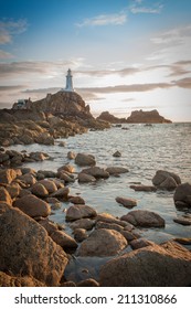 La Corbiere Lighthouse at sunset on Jersey in the Channel Islands, in the English Channel.