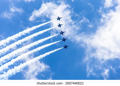 La Crosse, WI, USA - June 13, 2021: Blue Angles From US Navy Team Show Upside Down Fly Speed Skills Alignment With Engine Smoke Trace In Airfest 2021. Aviation Festival, Airshow Event In America.