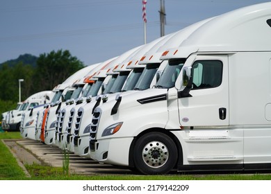 La Crosse, Wisconsin USA - July 2nd, 2022: A Line Of White Semi Trucks Parked Together Outside.