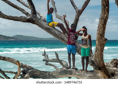 LA DIGUE, SEYCHELLES - AUGUST 25 2019 - Young Islands Boys Pose For Photographer. They Are Happy And Very Friendly People.