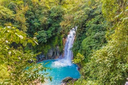 La Fortuna, Costa Rica. March 2018. A View Of The Blue Waterfall Rio Celeste In Costa Rica