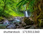 La Fortuna Waterfall in the forest with river, close to Arenal Volcano, Costa Rica national park. Central America.