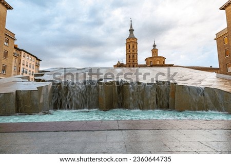 La Fuente del Hispanidad, the Spanish Fountain at Plaza del Pilar and church of San Juan de los Panetes in Zaragoza, Spain.