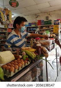 La Jagua De Ibirico, Colombia- 04 September 2021: Neighborhood Stores Are Still Preferred By Colombians When It Comes To Buying, Their Grocer Using Biosecurity Elements
