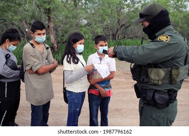 La Joya, TX, USA - May 26, 2021:  A Border Patrol Agent Processes A Group Of Unaccompanied Central American Minors Who Crossed The Rio Grande River Illegally To Request Asylum.