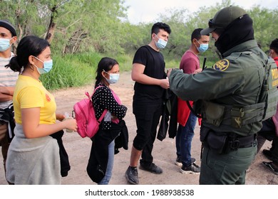 La Joya, TX, USA - May 26, 2021:  A Border Patrol Agent Processes A Group Of Unaccompanied Central American Minors Who Crossed The Rio Grande River Illegally To Request Asylum.